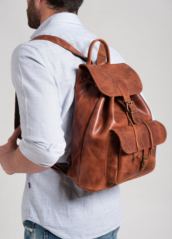 Large unisex leather backpack with a front pocket