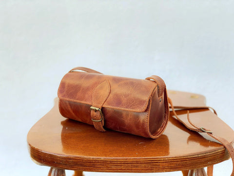 Women's small handmade brown barrel bag